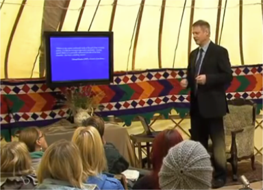 professor in the yurt with  the tv
